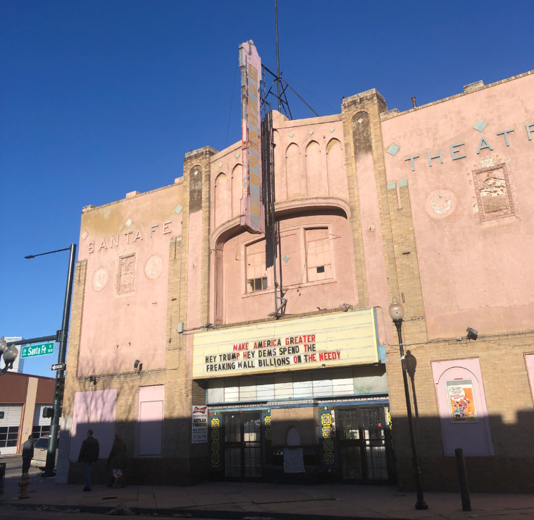 The run-down Aztlan Theatre’s marquee sign reads “make America greater, hey Trump hey Dems spend the freaking wall billions on the needy.”
