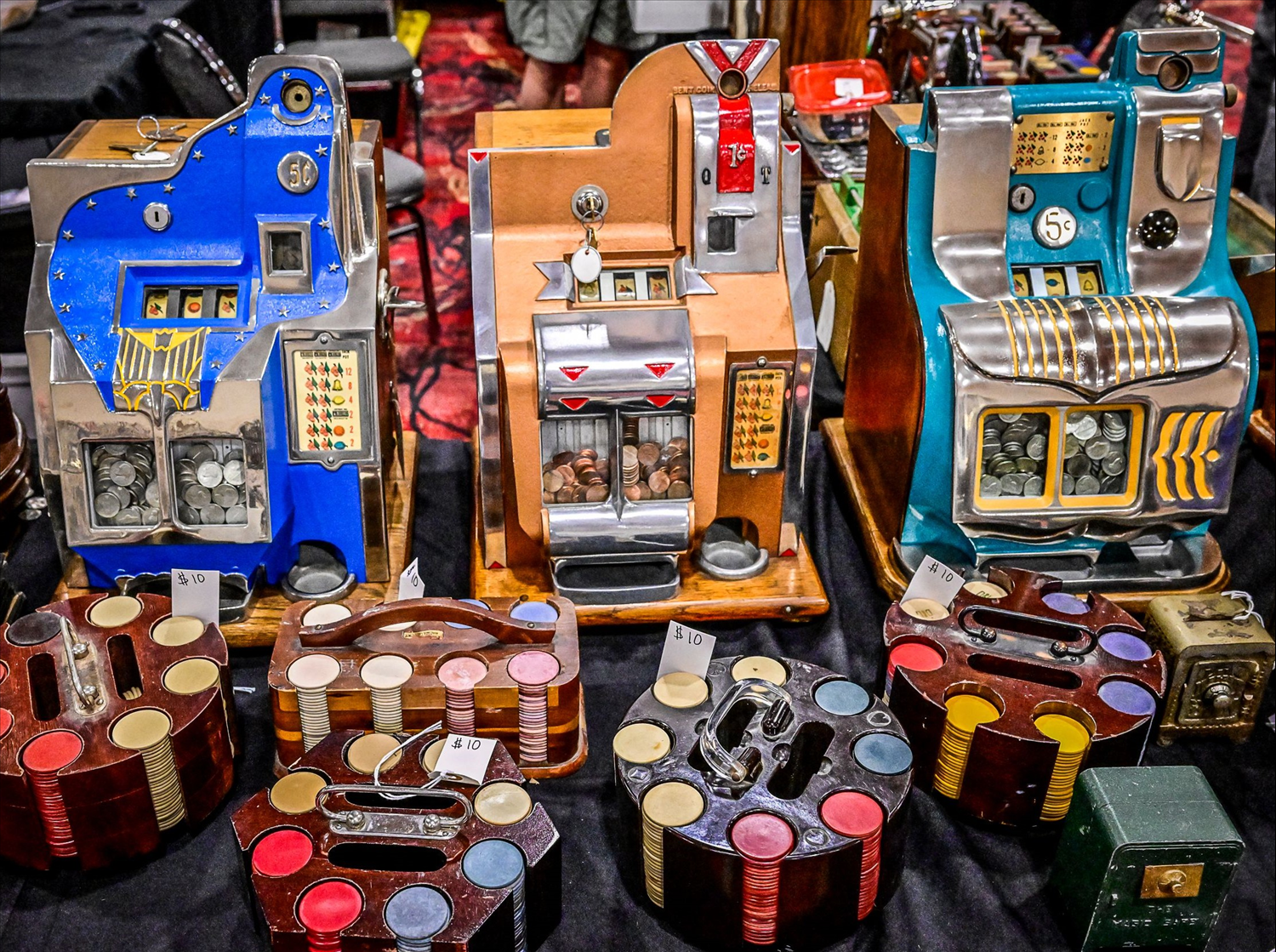Vintage casino chips and slot machines on display.