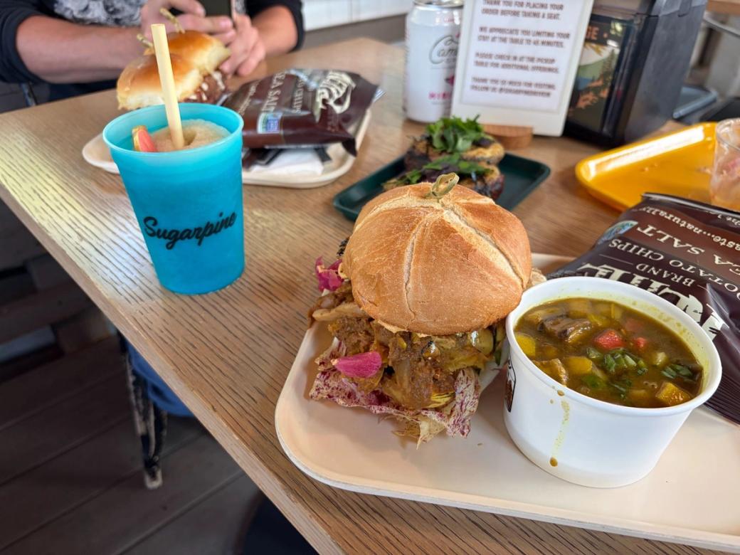 A pulled pork sandwich, soup, and apple cider slushy at Sugarpine Drive-In. 