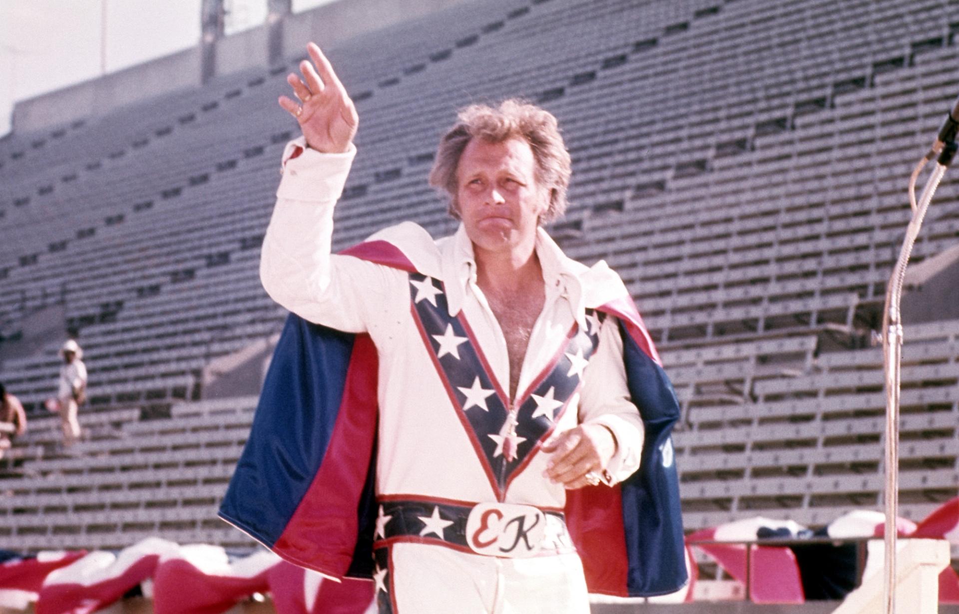 Evel Knievel waves to fans.