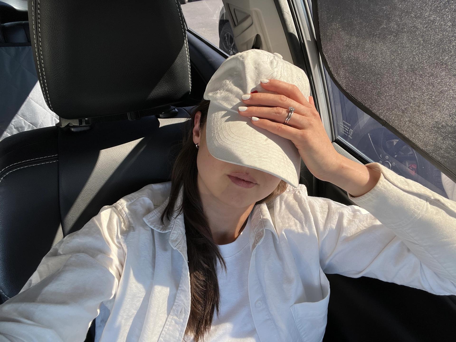 Photo of the author relaxing in her hot car.