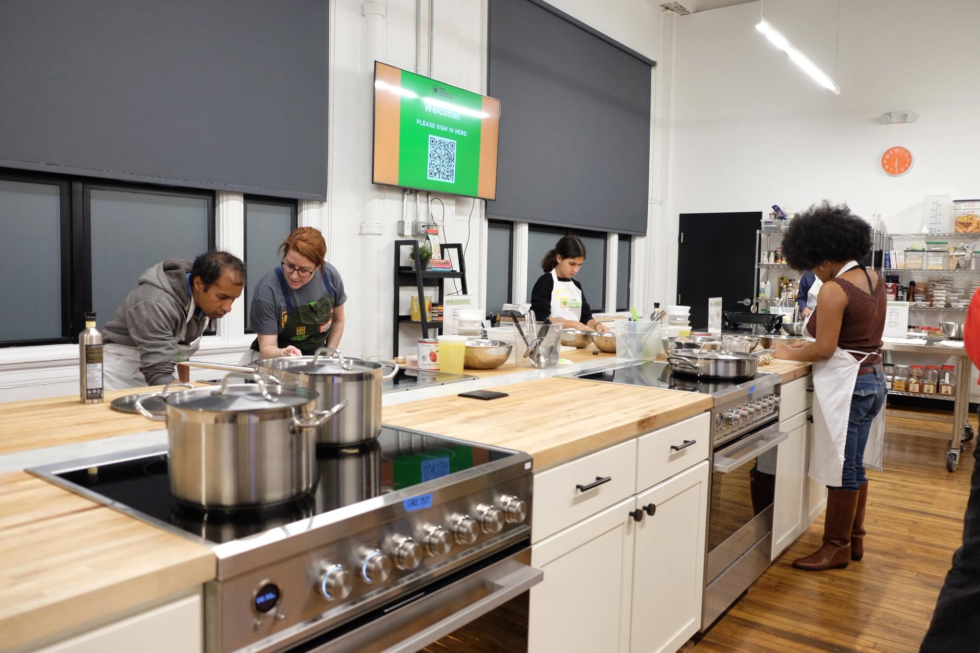 People participating in a cooking class in Philly.
