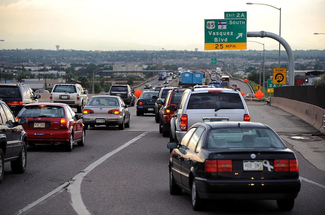 Cars and trucks sit in heavy traffic on I-270