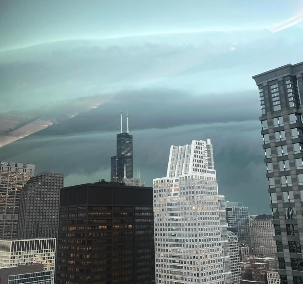 A view of a very clowdy day over the chicago skyline. The photo was taken at a high floor in a skyline