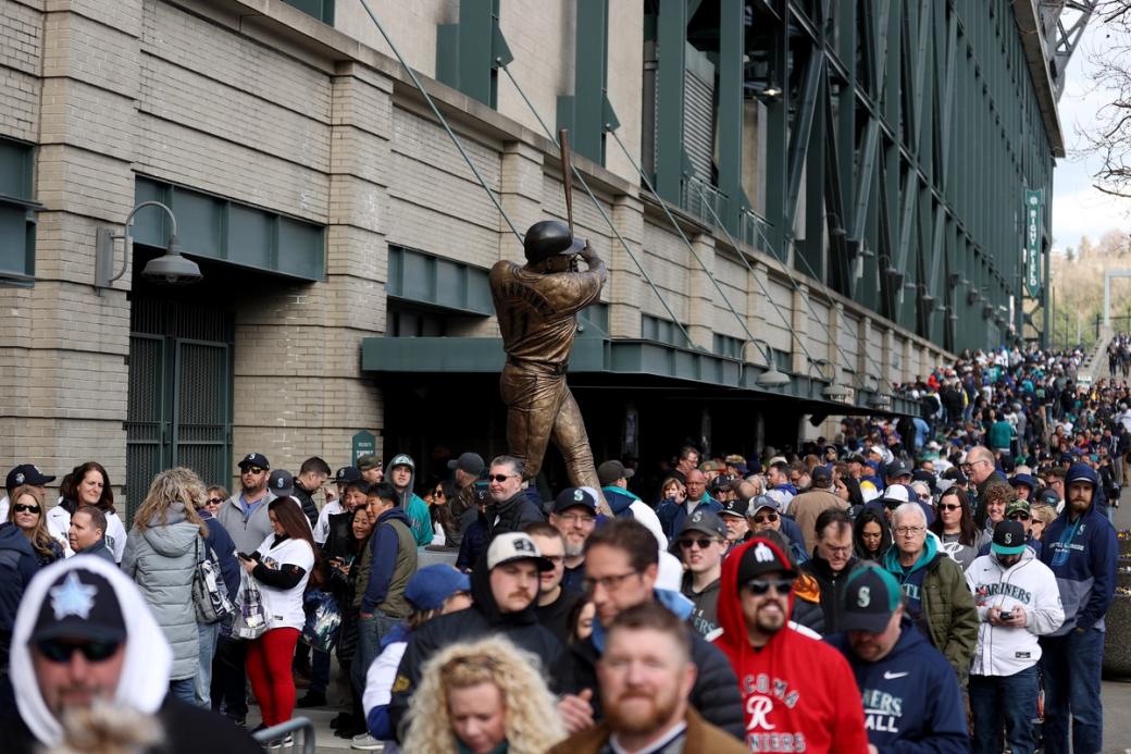 Fans wait outside T-mobile park waiting to enter for a game