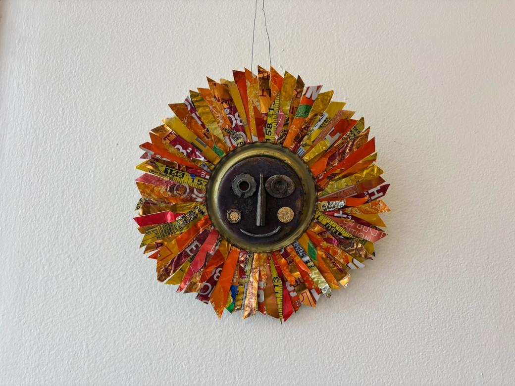 sun art piece made out of recycled material