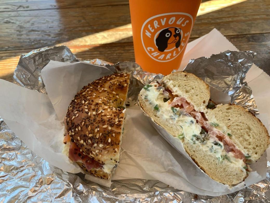 An everything bagel sandwich with cream cheese and scallions.