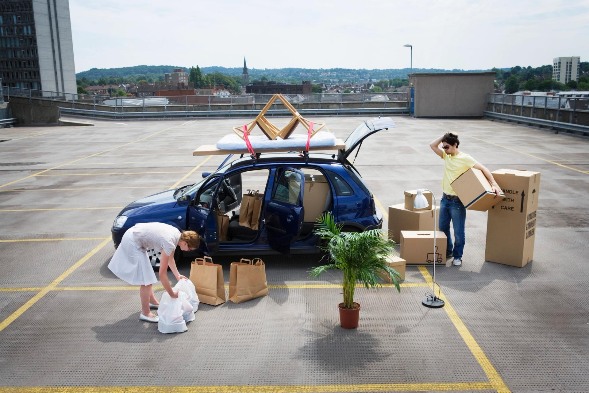 Photo of car being loaded with lots of stuff.