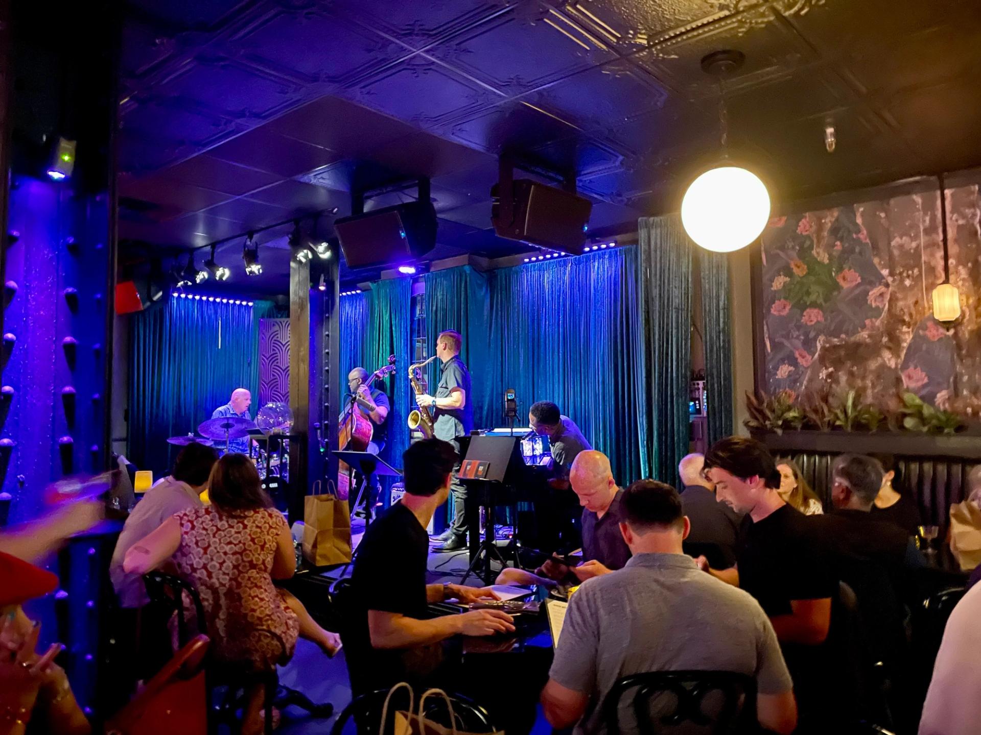 jazz band playing on a stage in a restaurant bar in Downtown