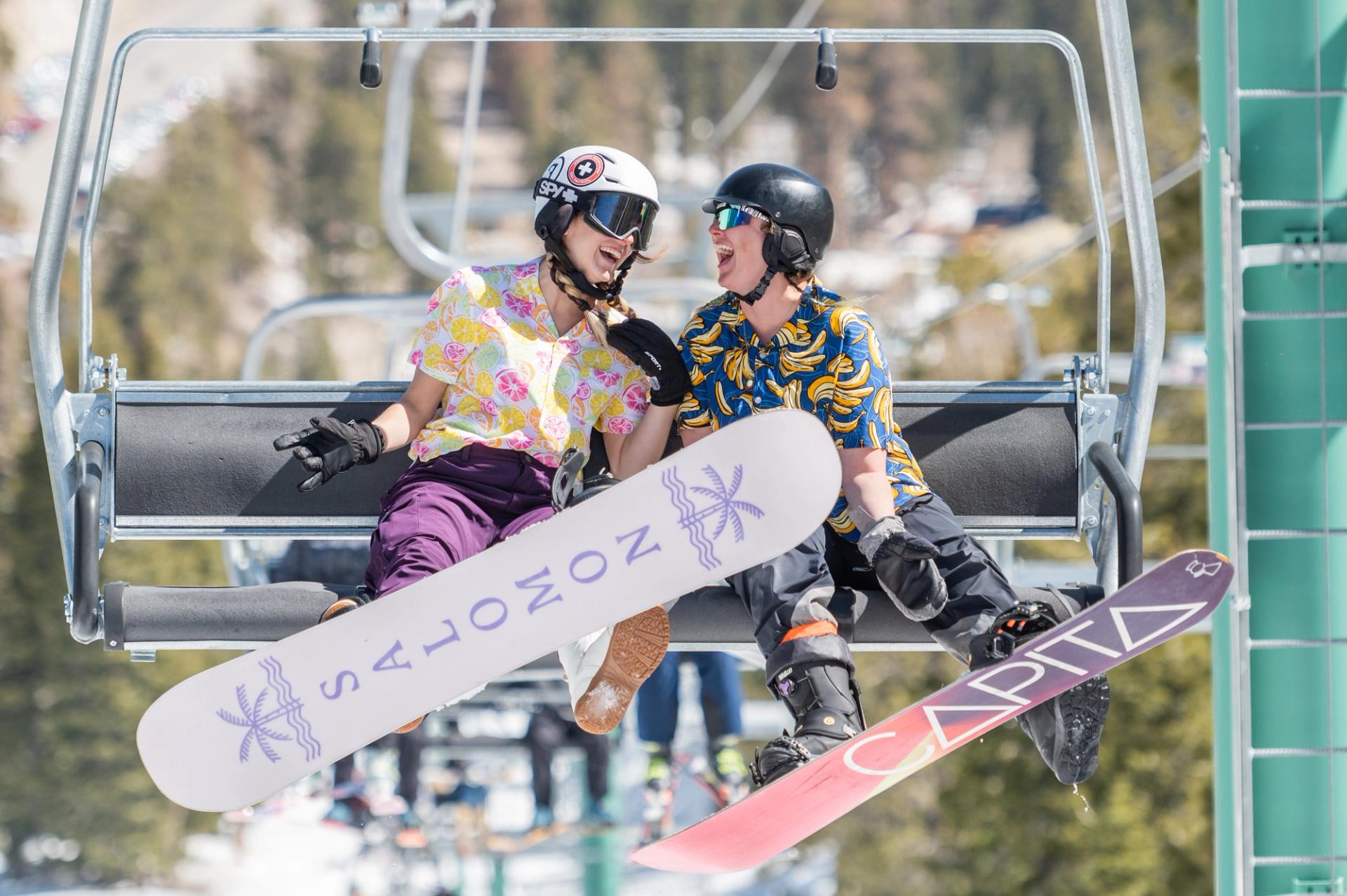 Two skiiers riding a ski lift up Mt. Charleston.