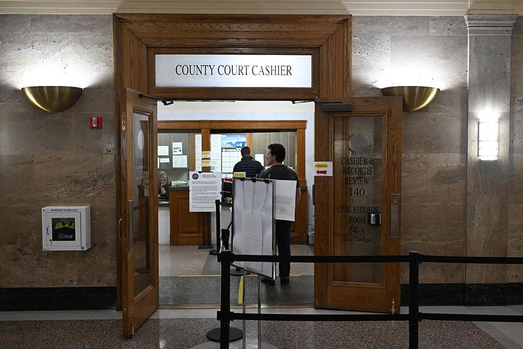 People wait in line at the County Court Cashier to dispute their parking tickets