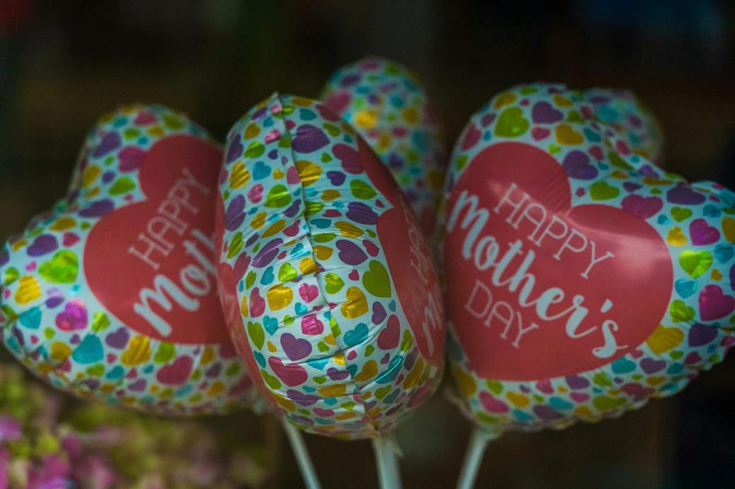 Heart-shaped balloons saying "Happy Mother's Day"