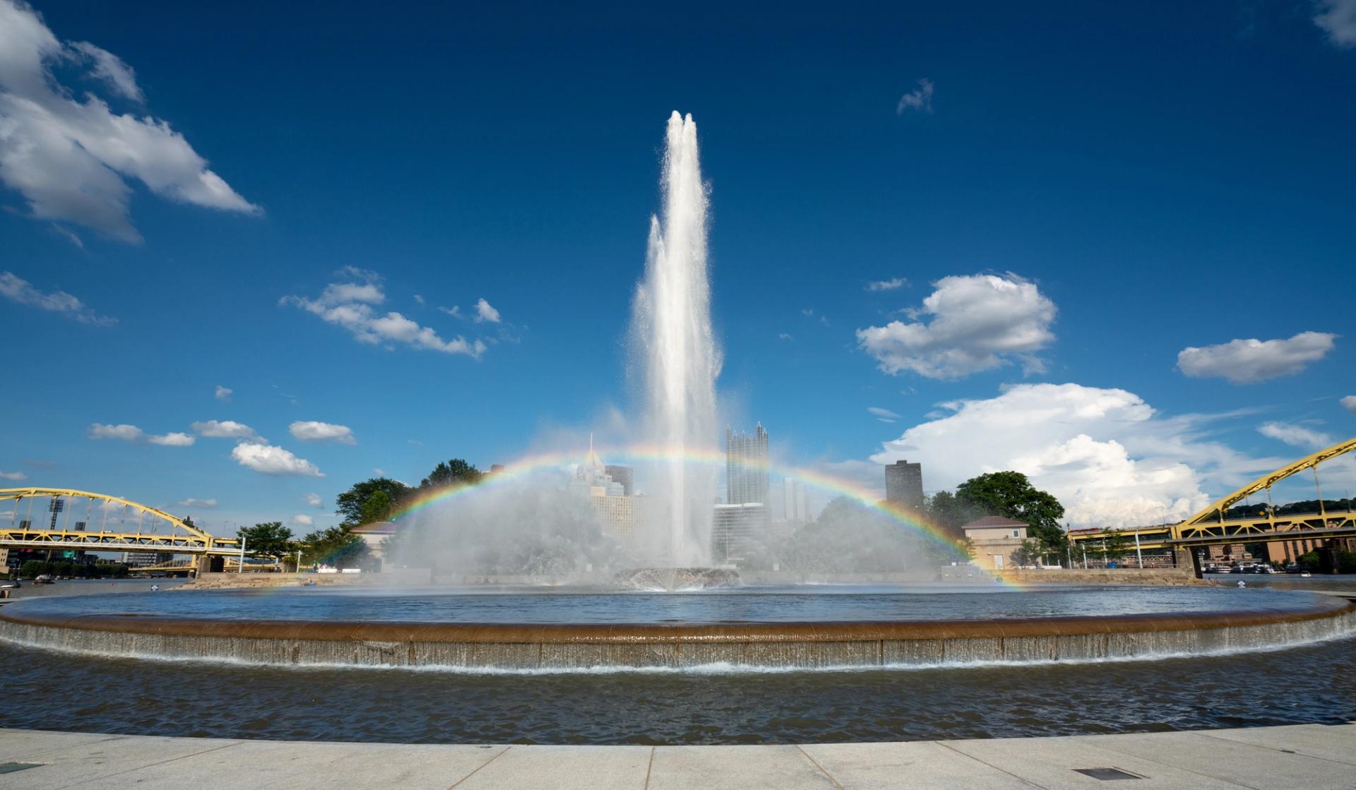 Water shooting from a fountain surrounded by a rainbow at Point State Park, Pittsburgh, Pennsylvania.