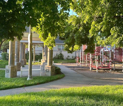 A playground at a park in Salt Lake City at sunset.