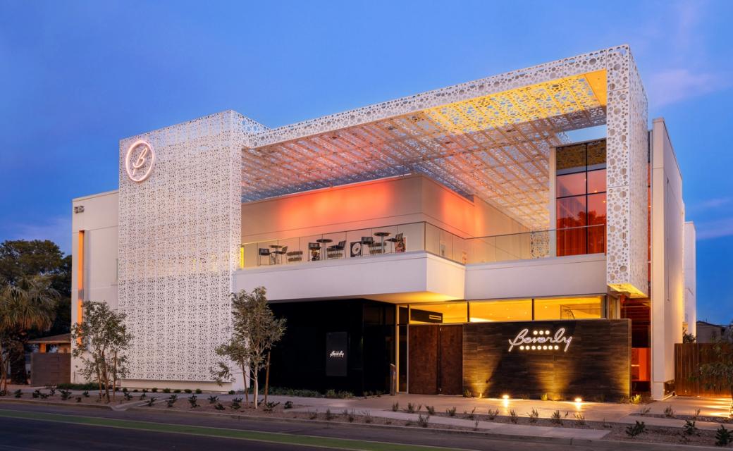The exterior of the Beverly Theater at dusk.