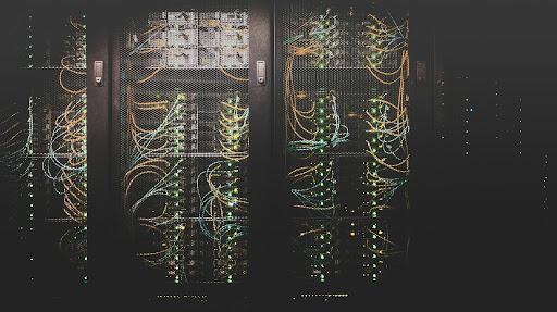 Locked data servers connected to orange and green wires