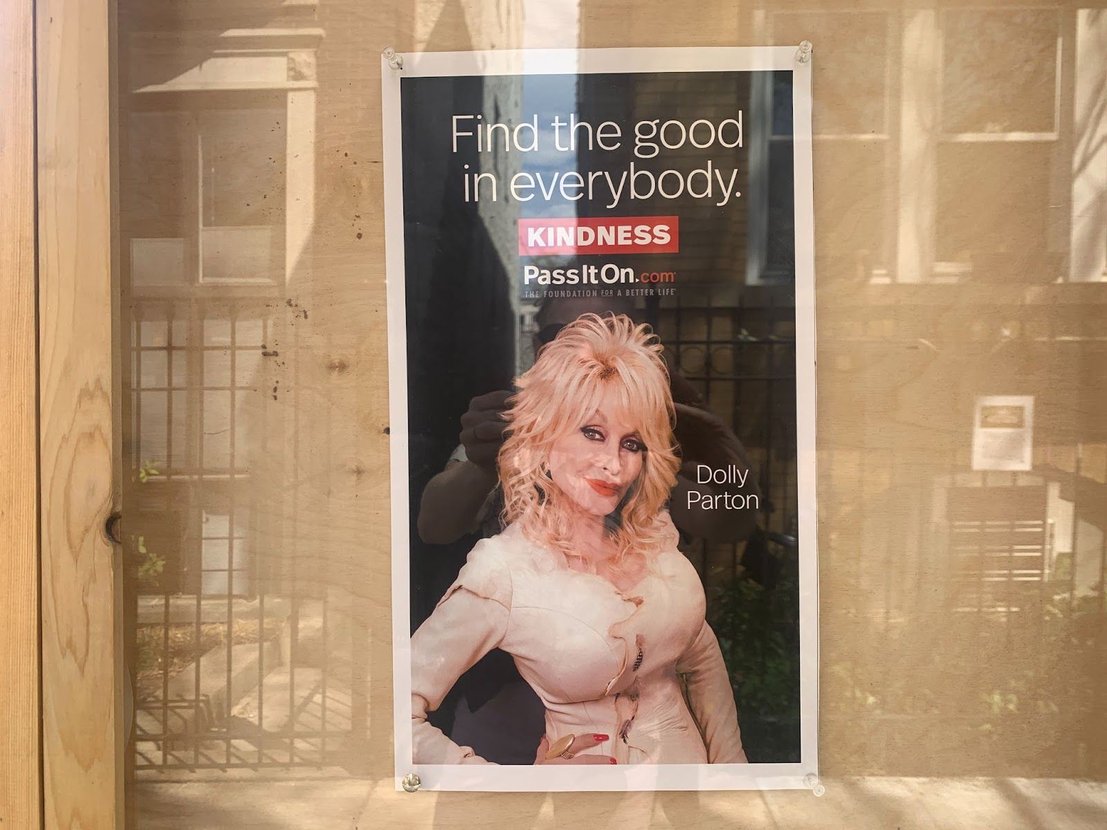 A Dolly Parton sign in a window