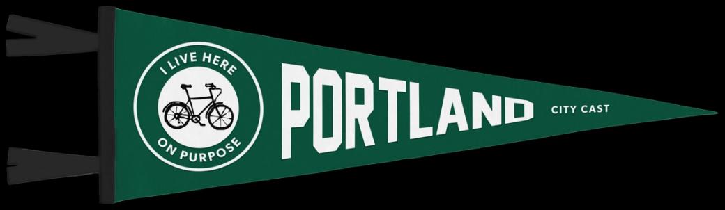 Green pennant with illustration of bicycle and sans serif text that reads, "I live here on purpose," "Portland," and "City Cast"