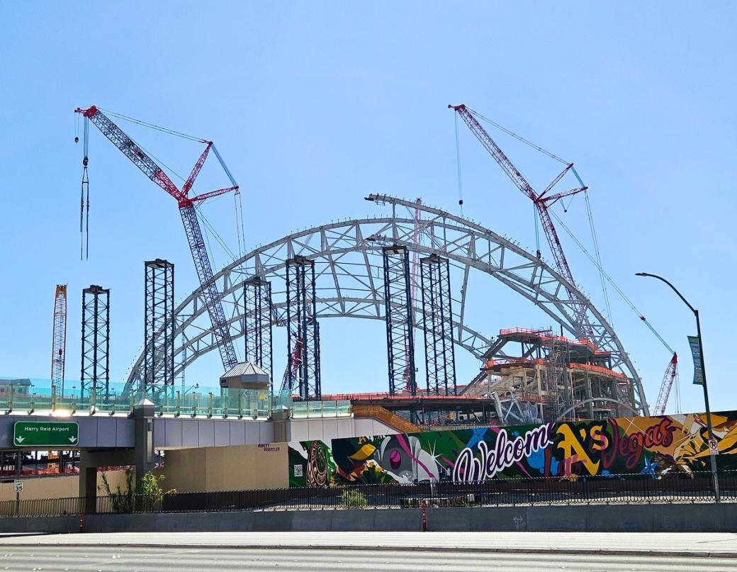 Steel beams and arches as a new building gets constructed.