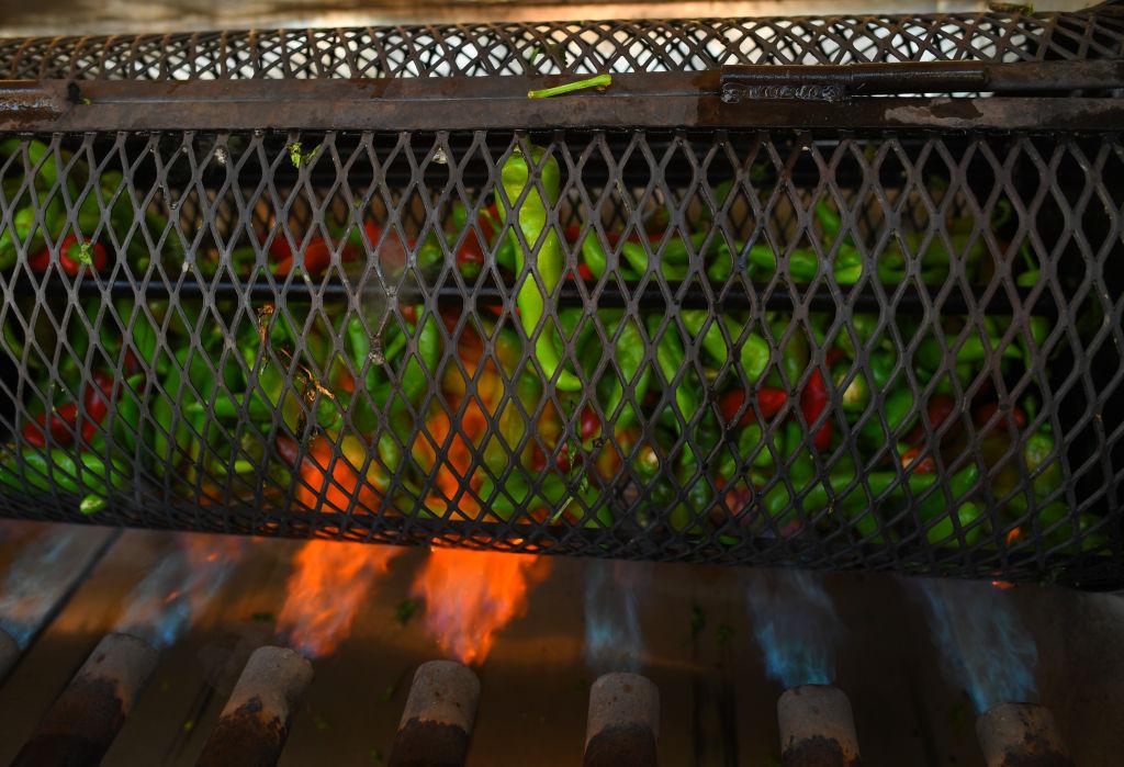 Pueblo chiles are turned in a roaster