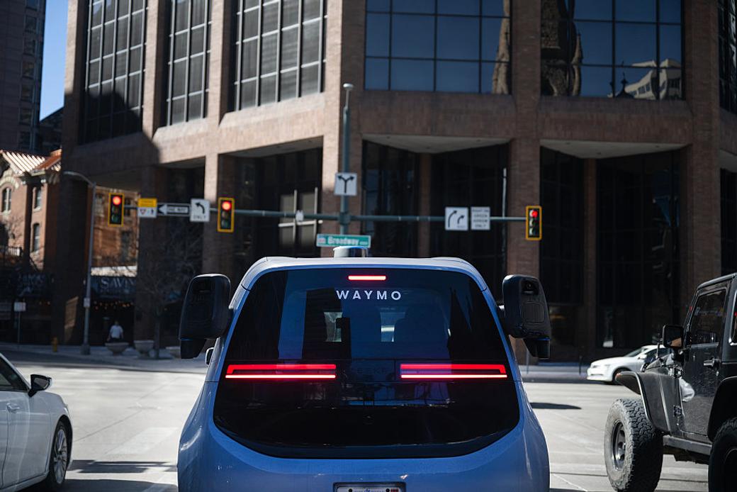 Waymo self-driving car waits at intersection in Denver