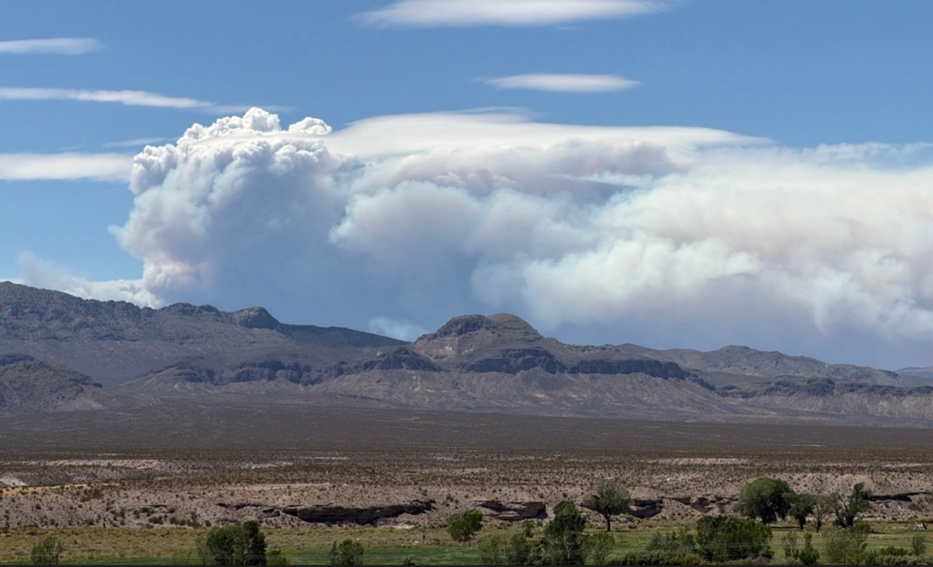 Smoke over hills.