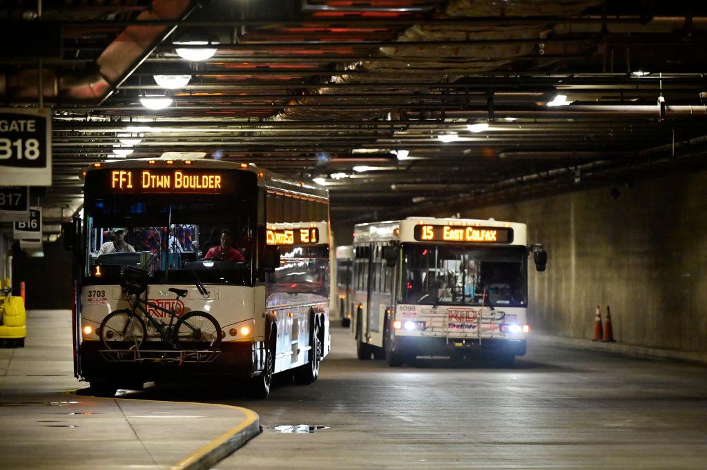 RTD buses travel through Denver’s Union Station bus concourse.