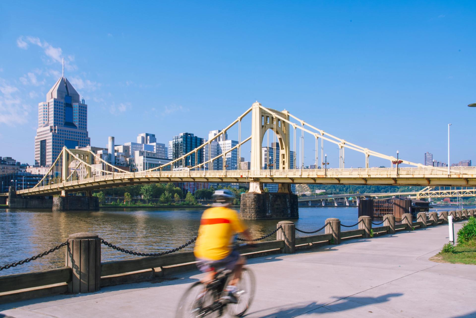 cyclist on the Three Rivers Heritage Trail in Downtown