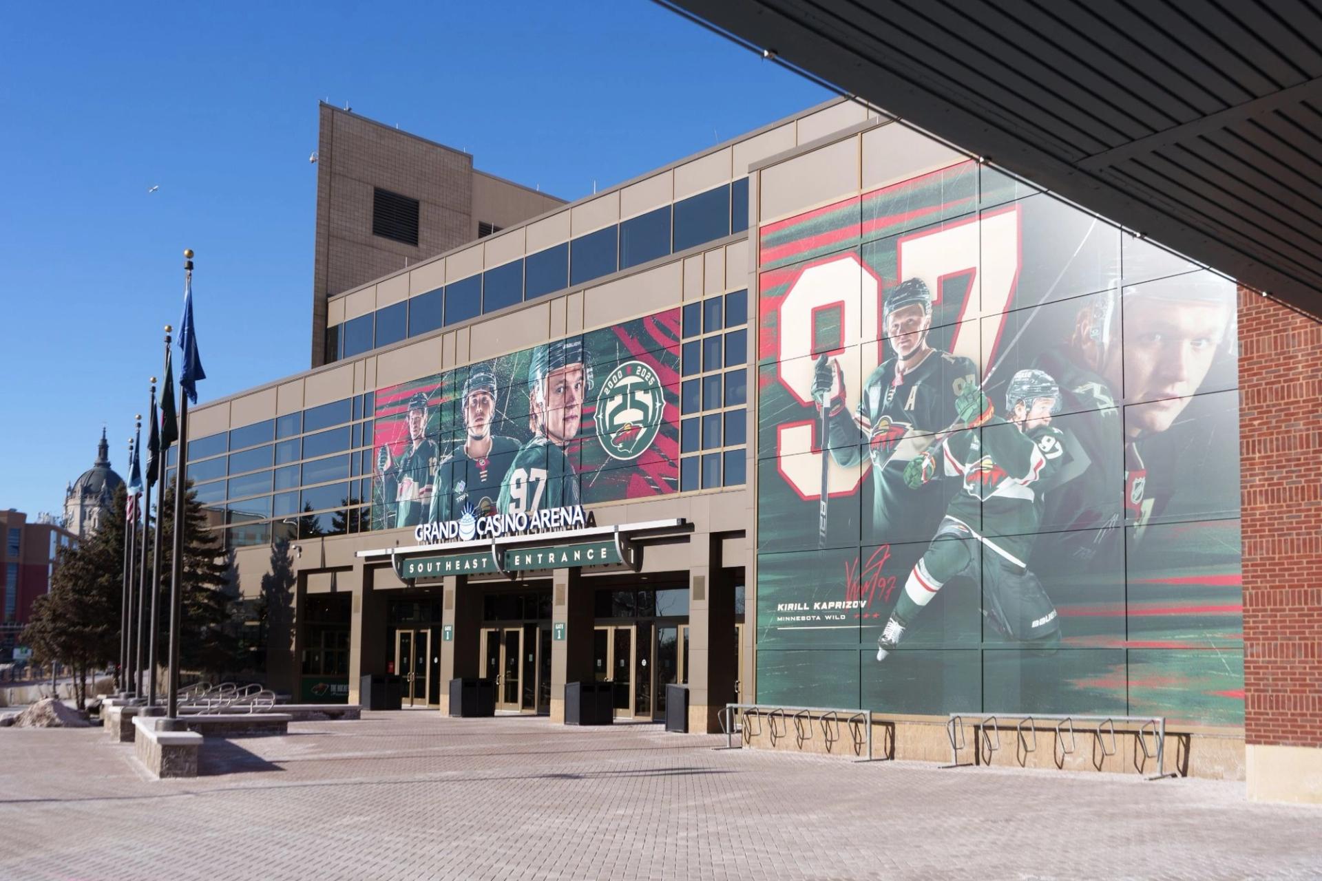 A view of outside an arena from the side. On the windows there's an assembly of hockey players. A larger piece shows 97 along with the player.