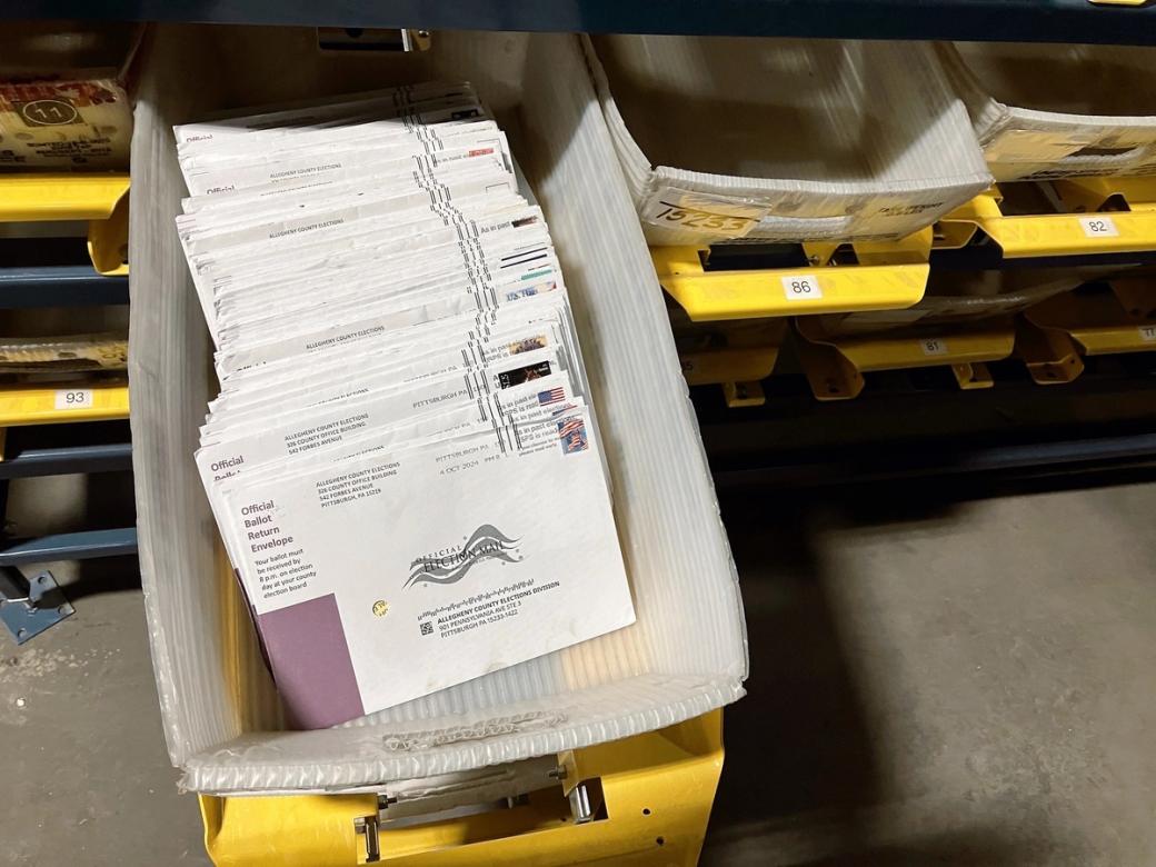 a mail tray holding mail ballots