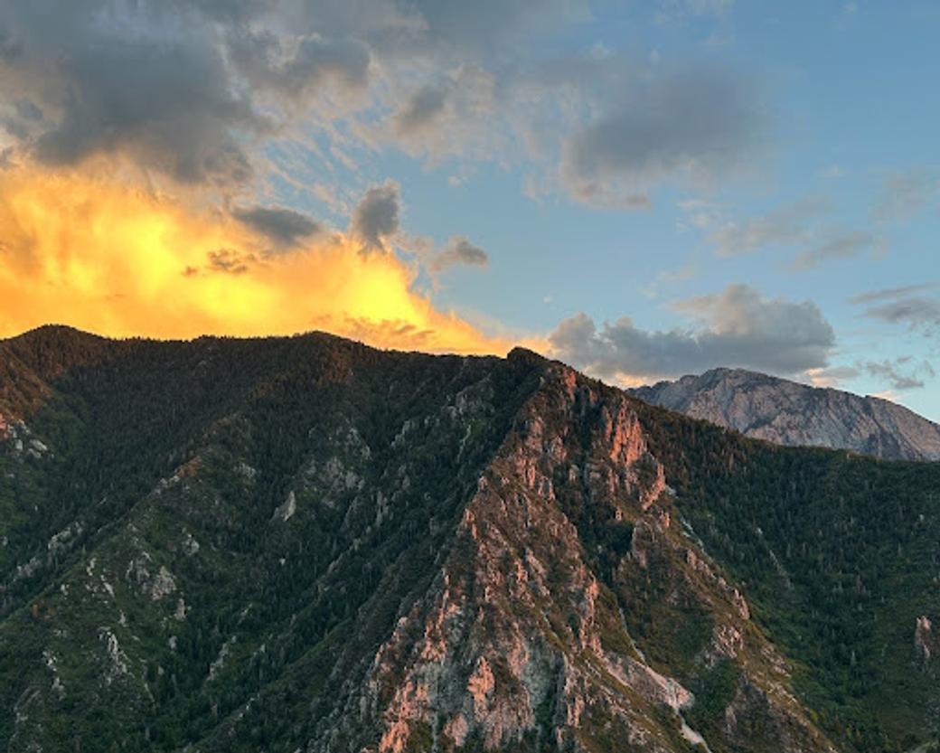 The Wasatch Mountains with blue sky and clouds. 