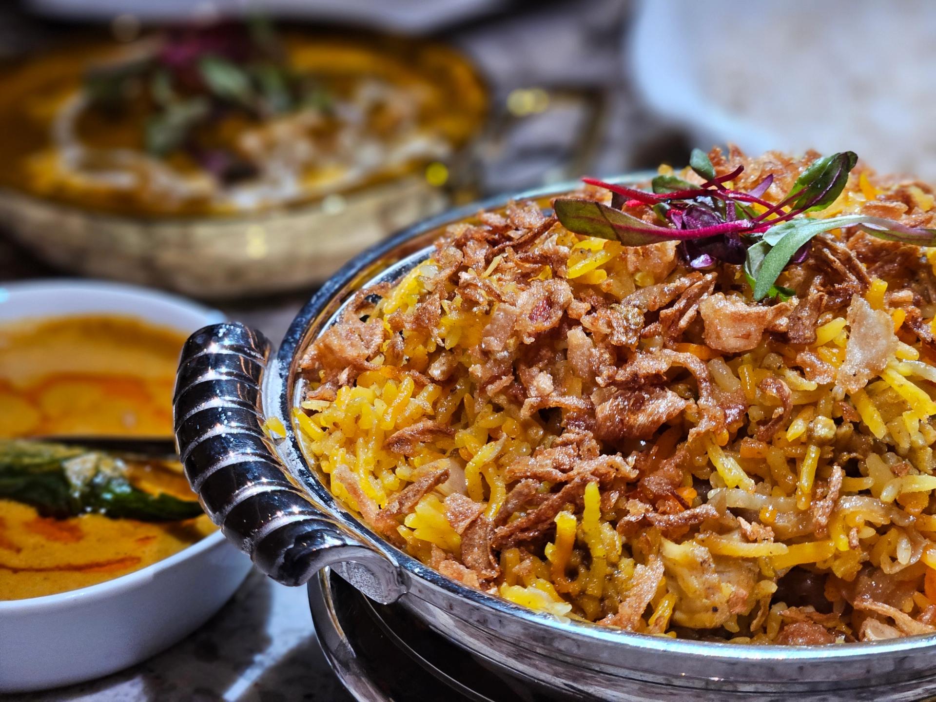 Bowl of rice and other dishes of food.