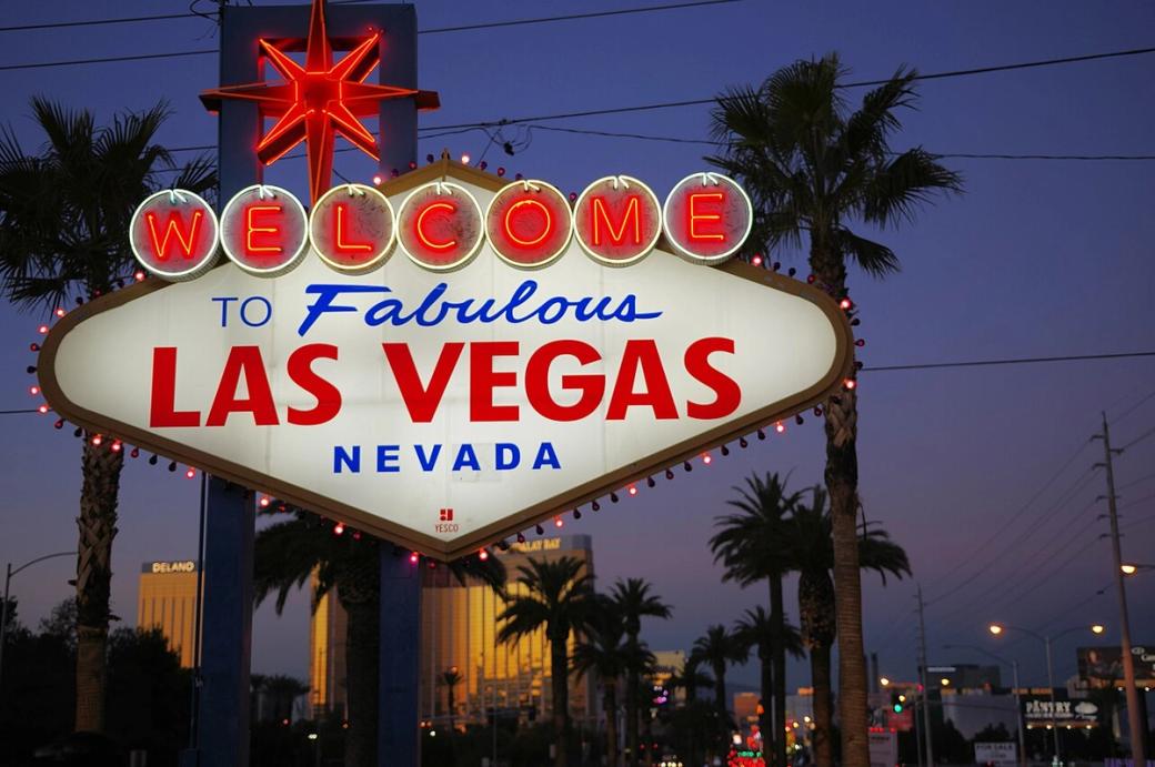 A vintage red, white and blue, sign reads "Welcome to Fabulous Las Vegas, Nevada"
