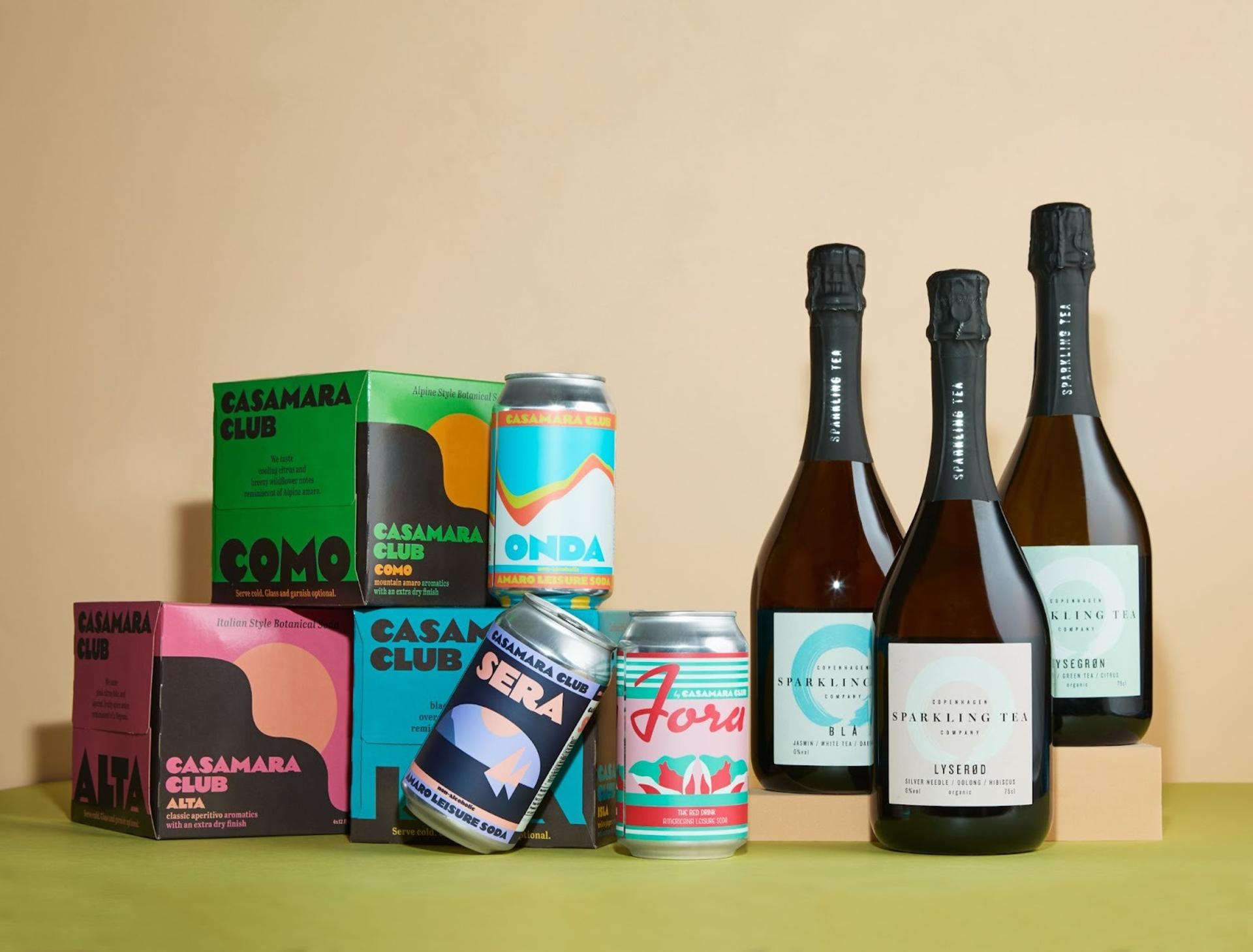 three bottles of wine, 3 cans, and three boxes