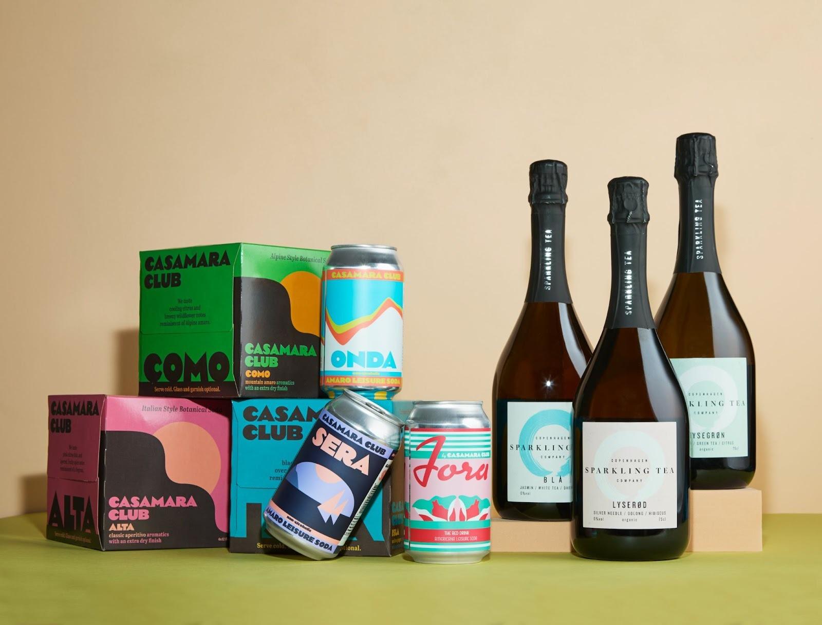 three bottles of wine, 3 cans, and three boxes