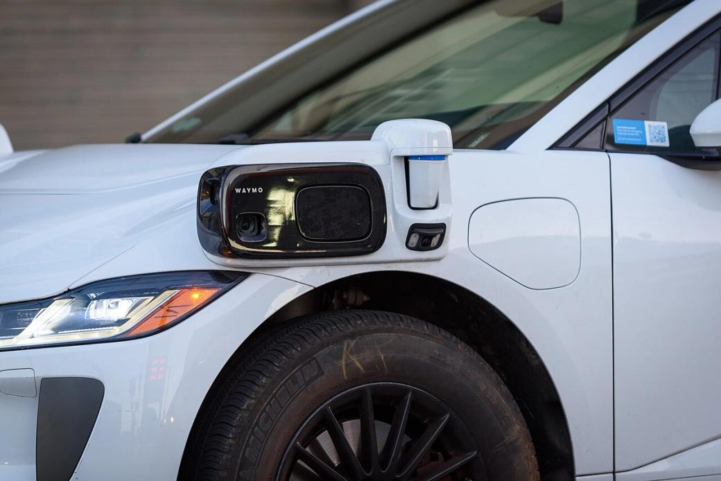 A white Waymo vehicle.