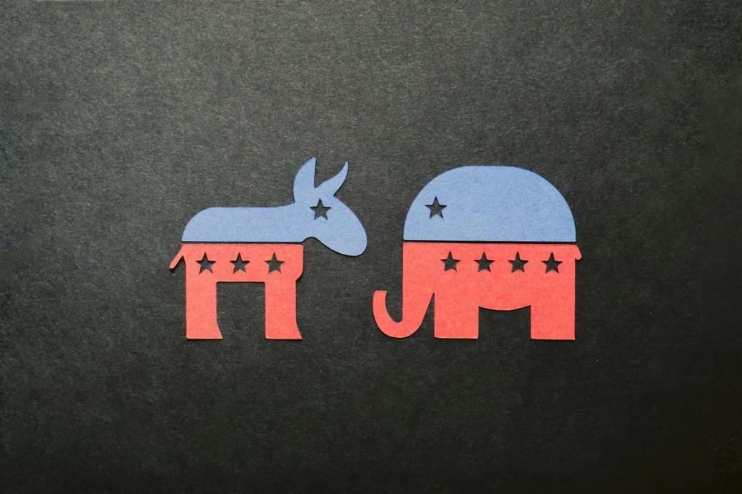 Paper cutouts of Democrat and Republican party symbols