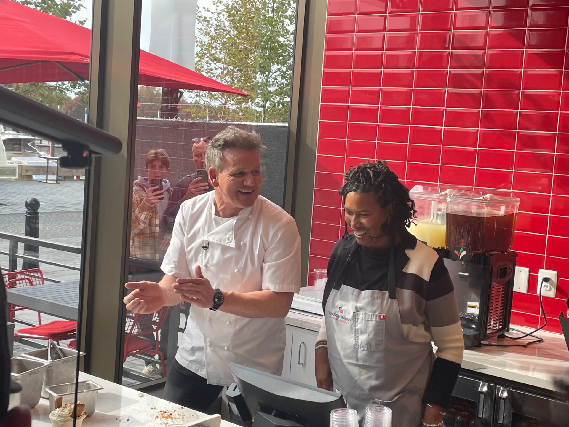 Gordon Ramsay breaking in the new kitchen with Mayor Bowser. (Kaela Cote-Stemmermann/City Cast DC)