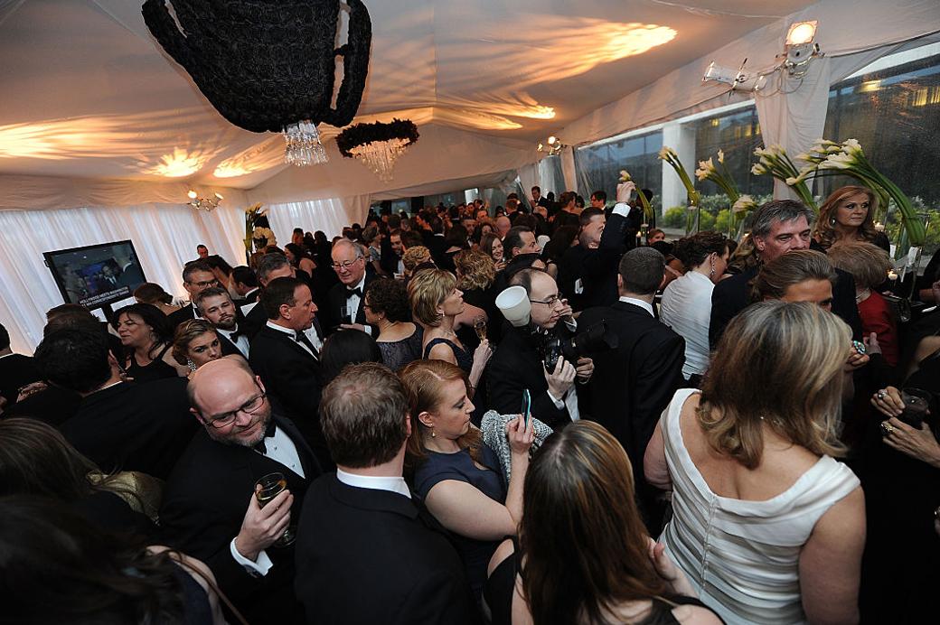 A photo of people at a dinner reception