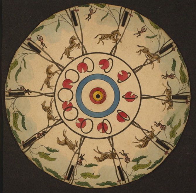 A circular nineteenth-century optical toy printed with repeated figures, animals and coloured rings around a central hole.