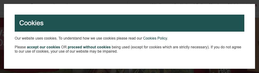 Cookie banner headed 'Cookies' with a plain text link to 'accept our cookies' OR 'proceed without cookies', hard to tell apart from the surrounding text.