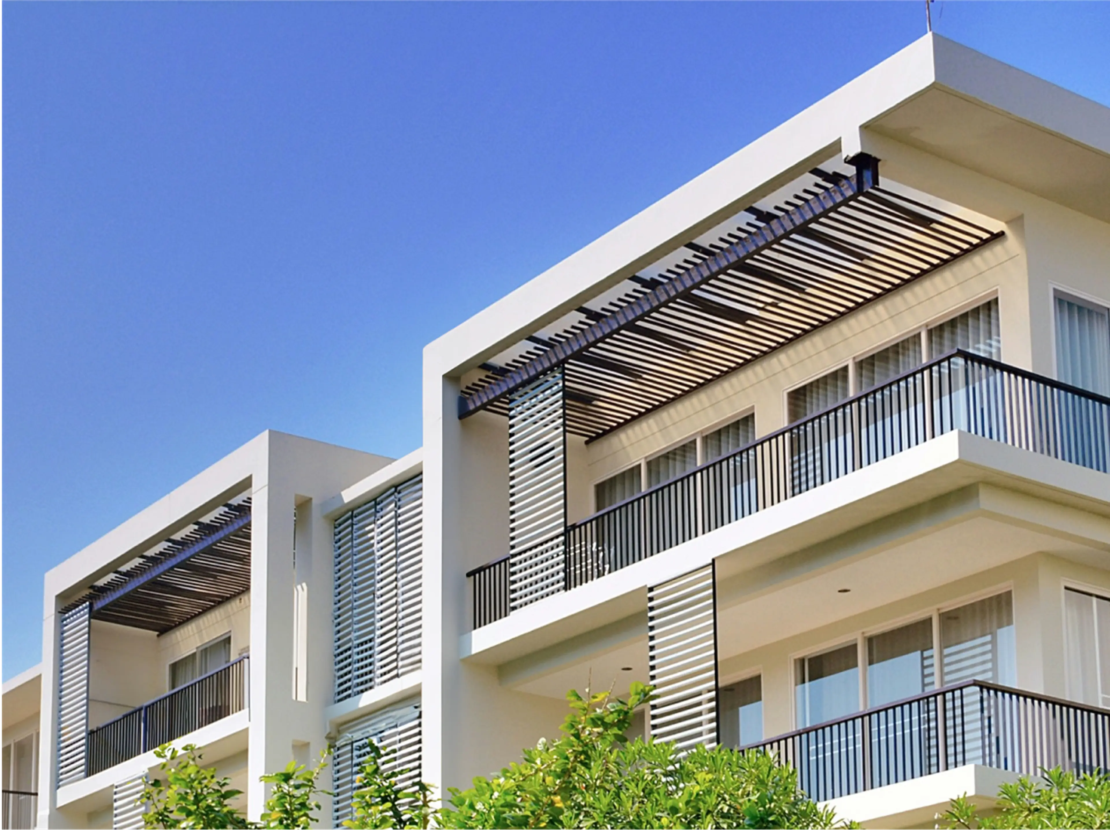 White multifamily building with balconies