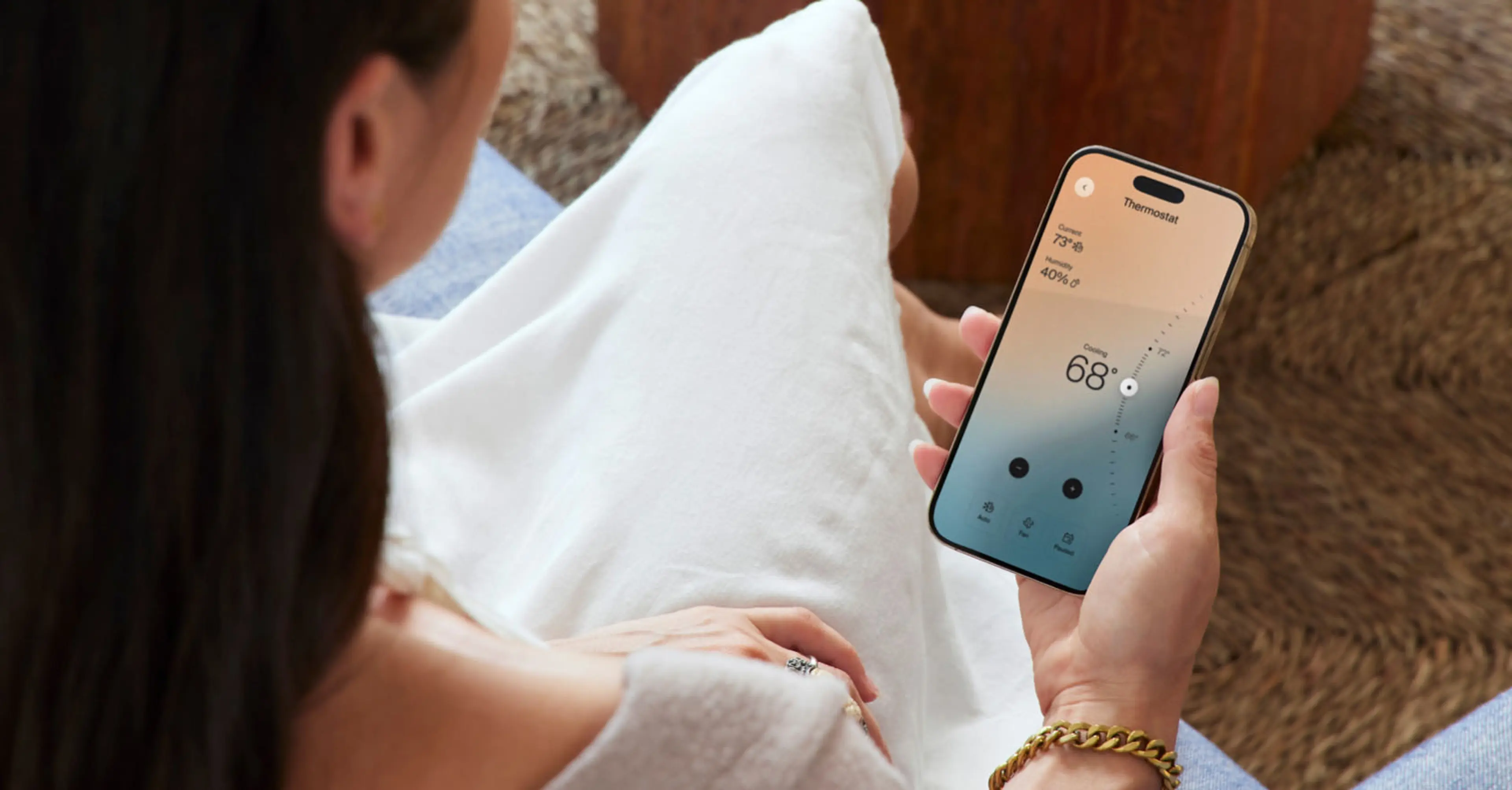 Resident controlling temperature through smart home tech from mobile app