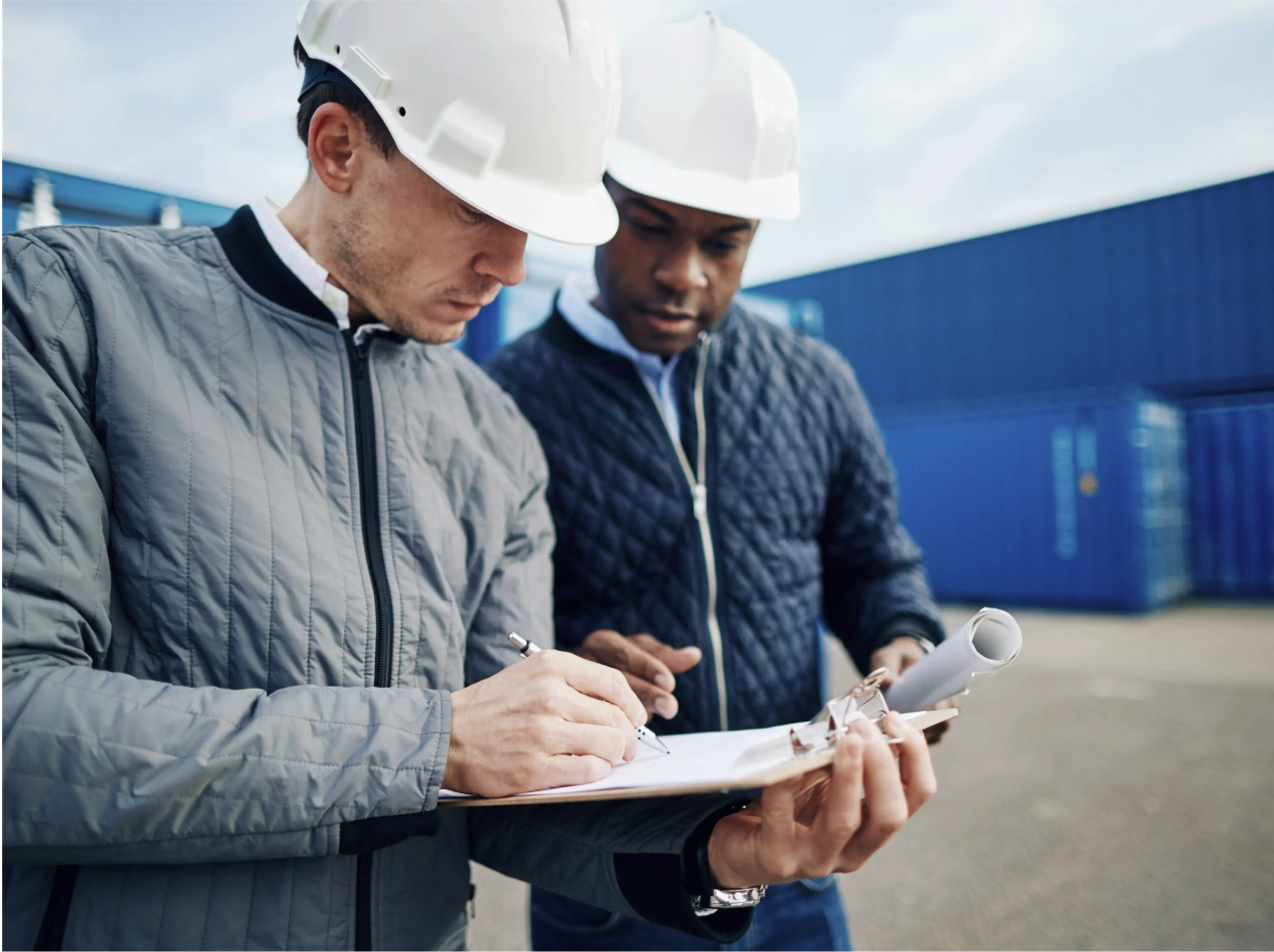 Two men wearing hard hats 