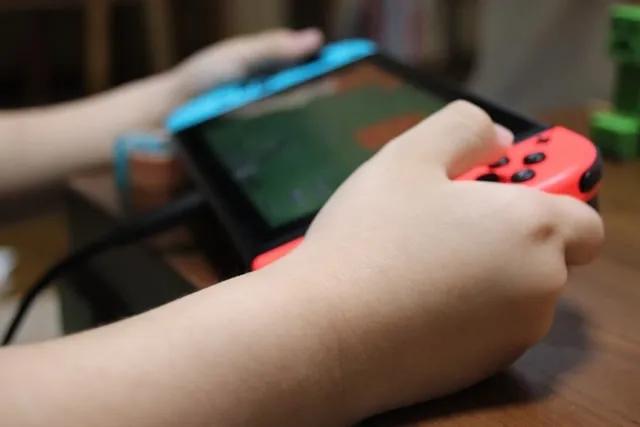 Image of someone holding a Nintendo Switch