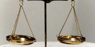 image of a metal weighing scale