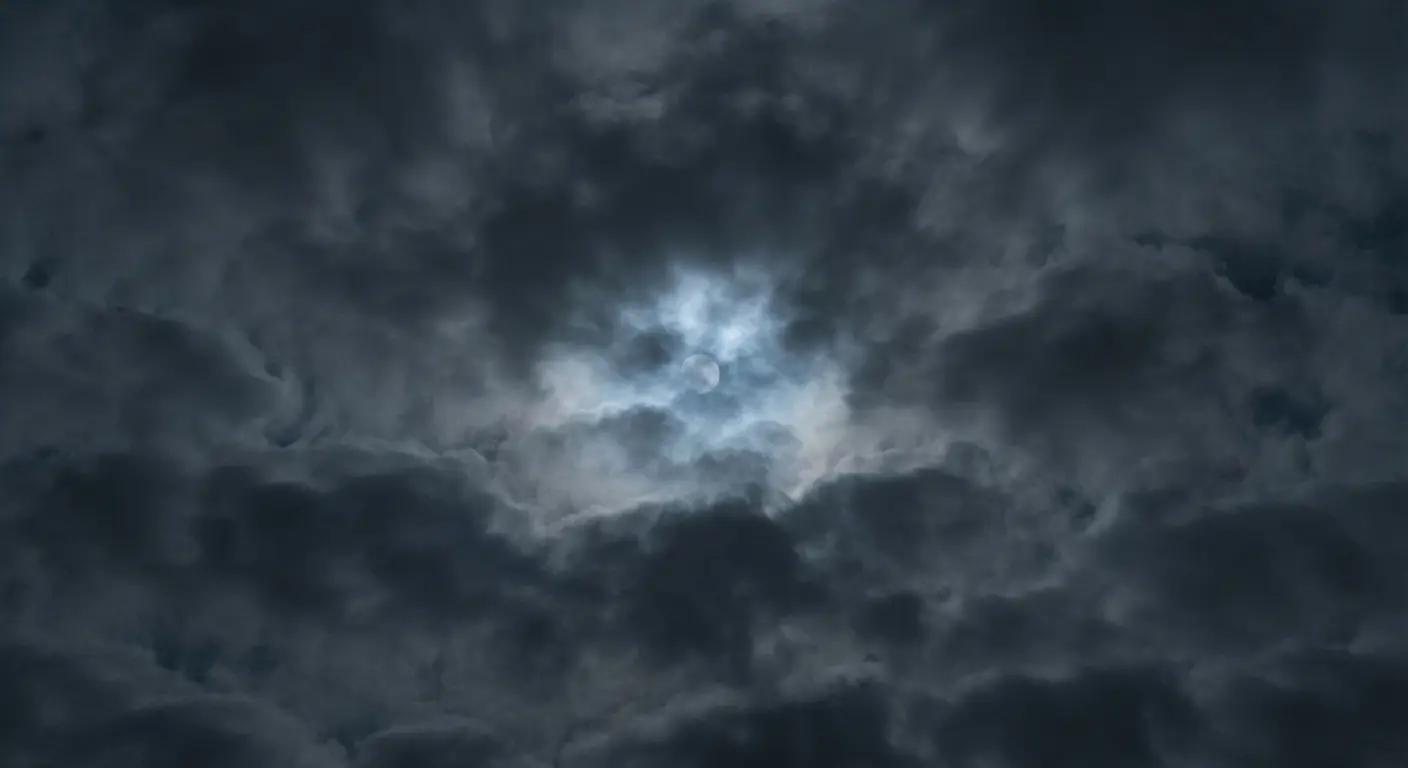 A glowing full moon faintly visible behind dense, dark night clouds, illustrating the Japanese aesthetic concept of Ugetsu (rainy moon) or Mugetsu (cloud-covered moon).