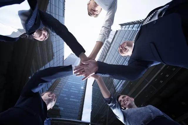 People putting hands together