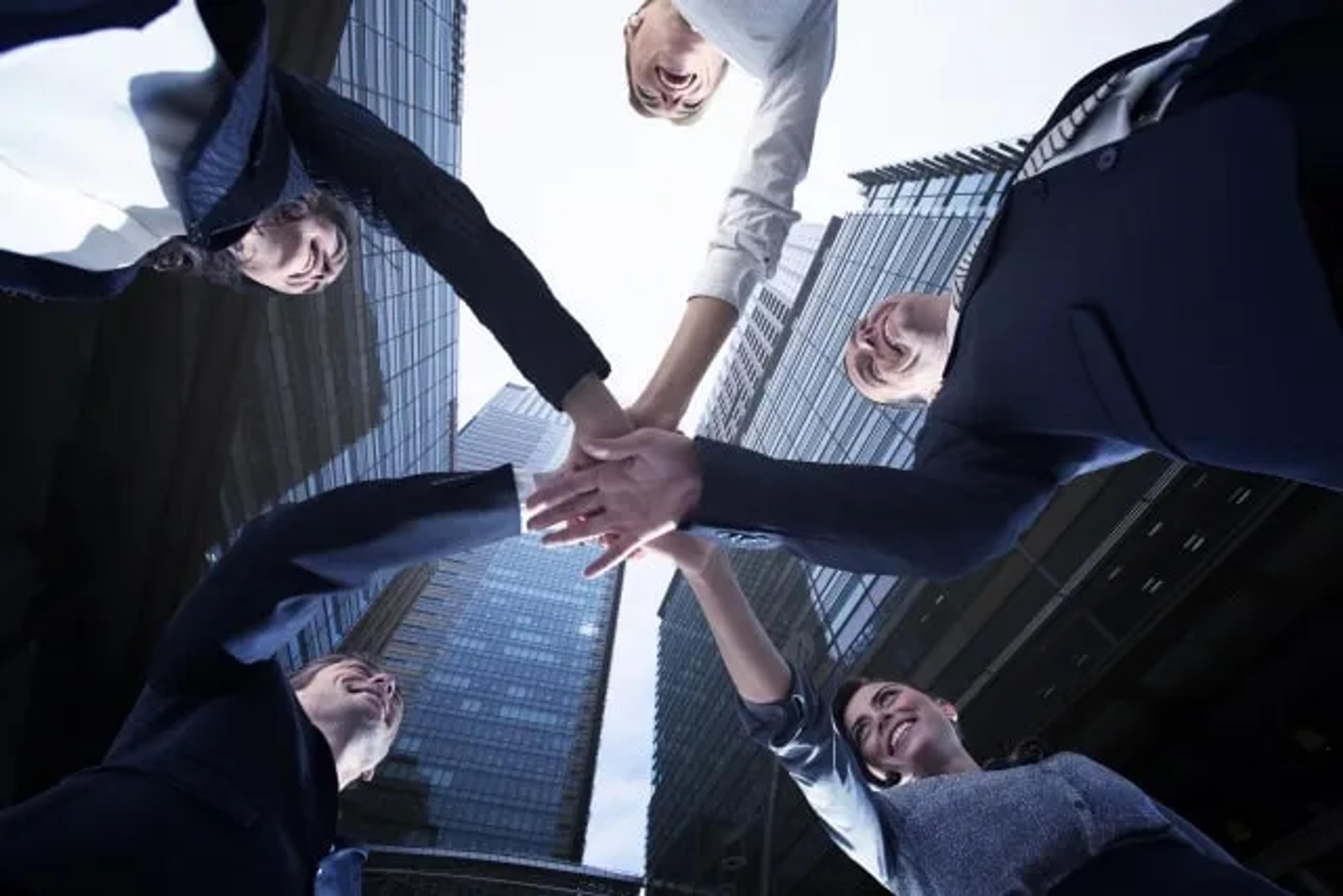 People putting hands together