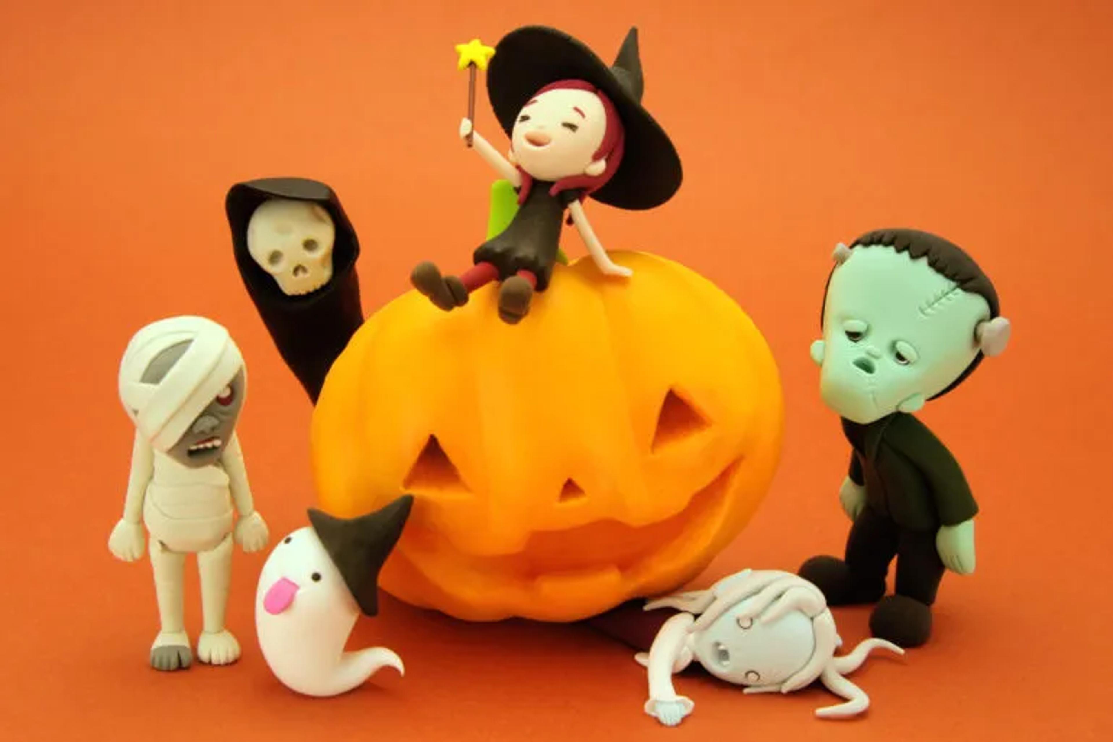 Halloween Monsters around a Pumpkin